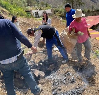 Preparing pachamanca with hot stones in the countryside
